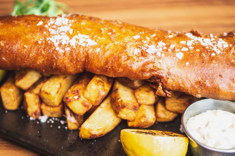 Dining at Metro West End Fish and chips on charcoal board