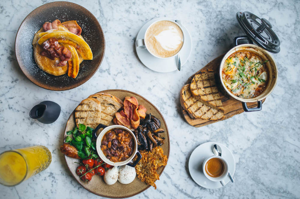 Breakfast dishes on marble table