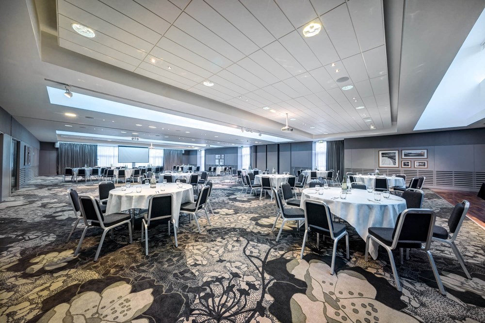 City Quay Suite set up cabaret style with round tables and white tablecloths