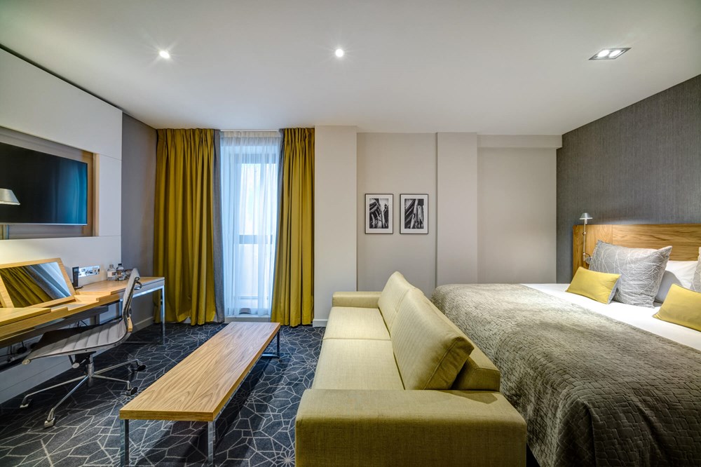 Family Room with double bed and sofa bed at Apex City of Glasgow Hotel