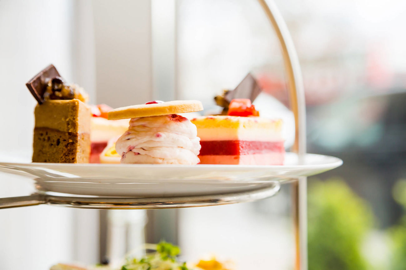Top tier of afternoon tea stand with cakes