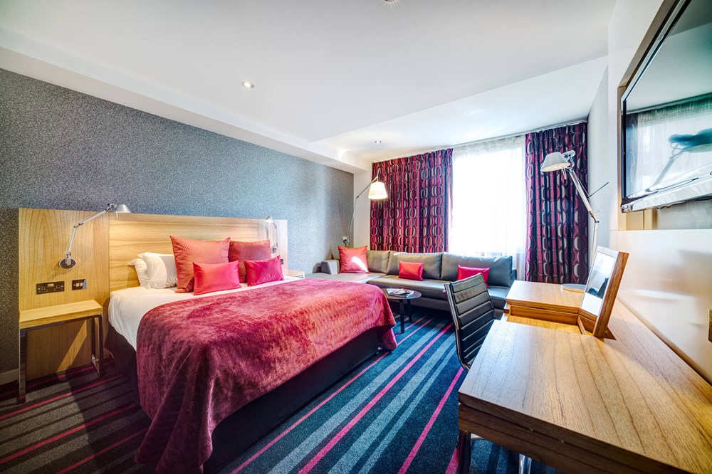 Family Room with queen-size bed, sofa bed and desk at Apex City of Edinburgh Hotel