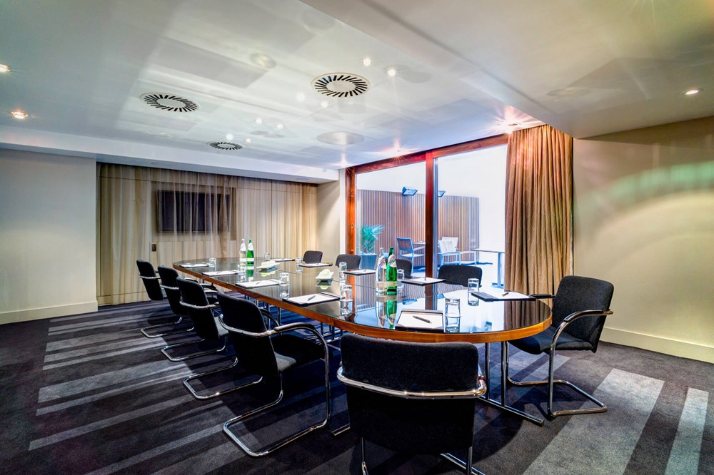 New York room set up boardroom style with floor to ceiling windows and outdoor terrace