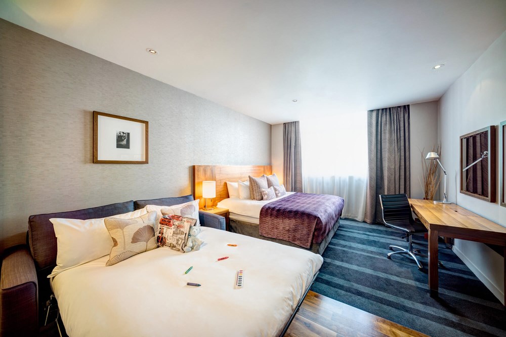 Family Room with king-size bed and sofa bed at Apex City of London Hotel