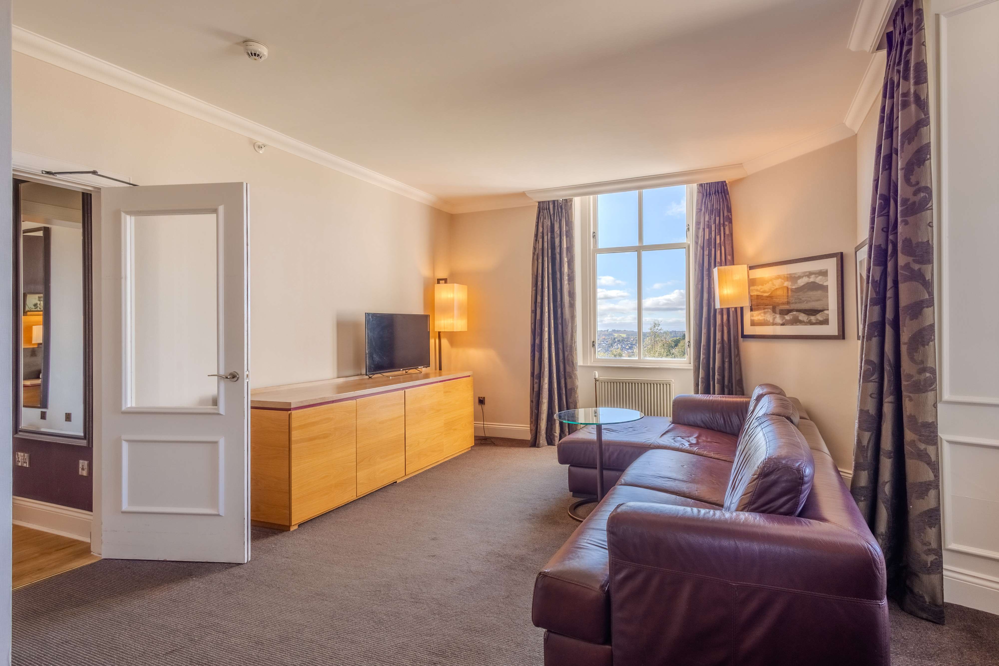 superior suite living area at apex dunblane hyrdo hotel