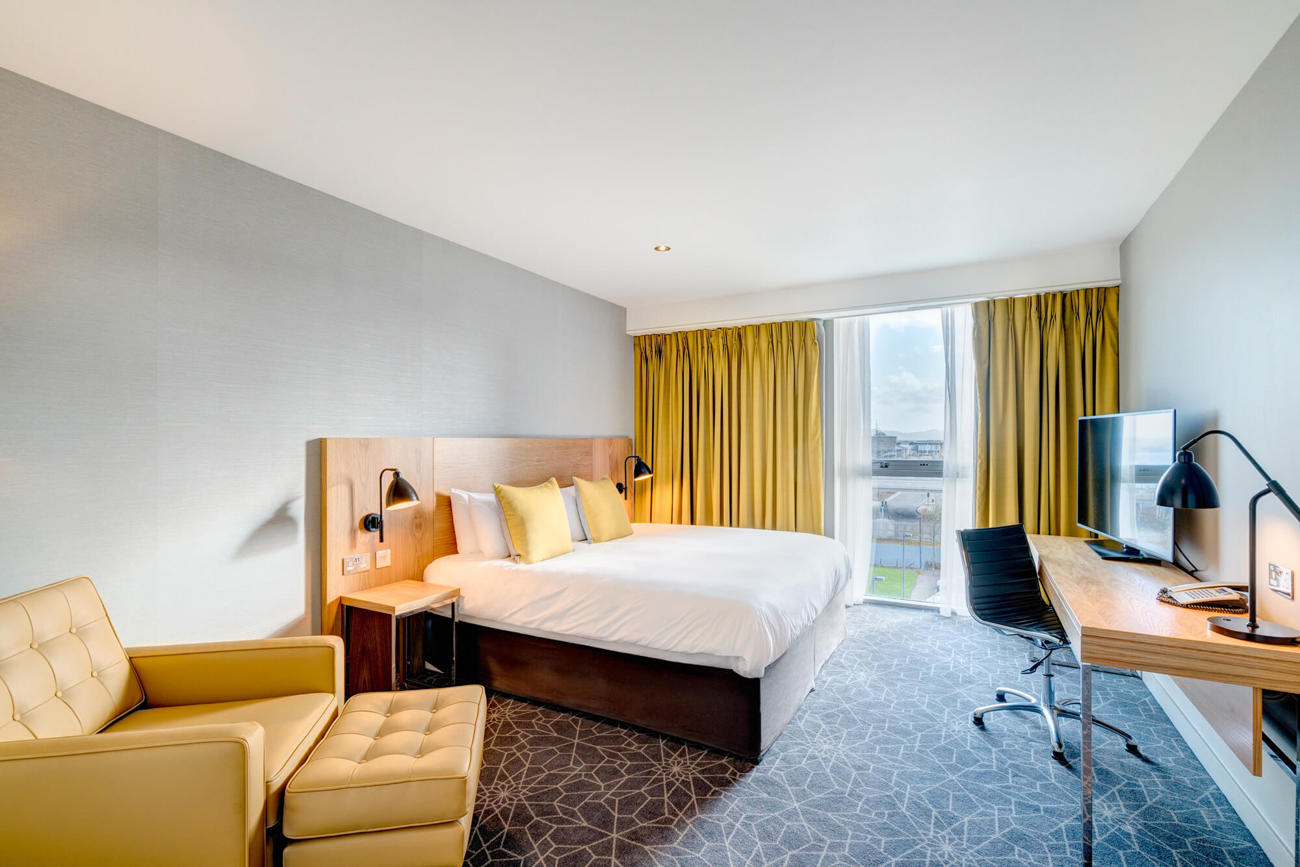 City Room at Apex City Quay Hotel & Spa Apex City Quay Hotel City Bedroom with double bed, large desk and arm chair