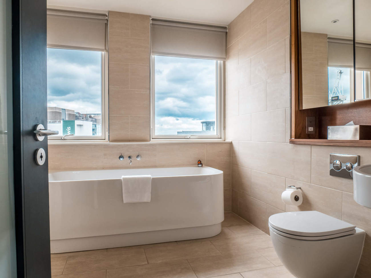 Deluxe Room bathroom at Apex Waterloo Place Hotel Freestanding bathtub in Deluxe Room at Apex Waterloo Place Hotel