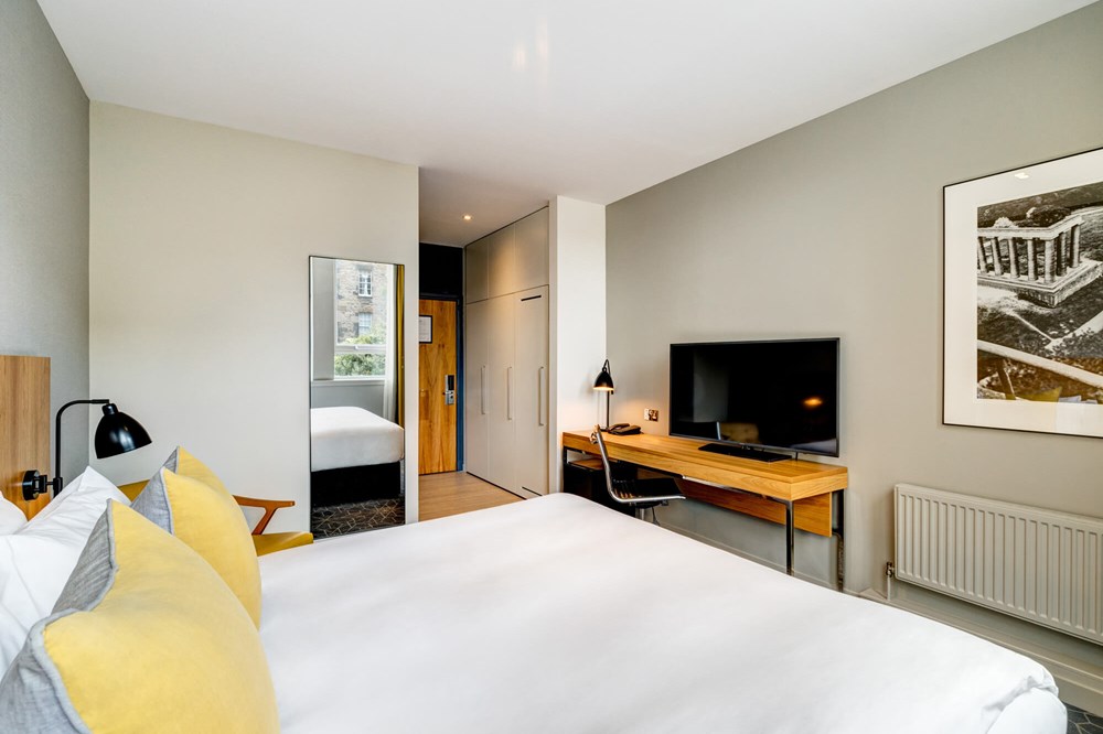 City Room with queen-size bed, desk and TV at Apex Grassmarket Hotel