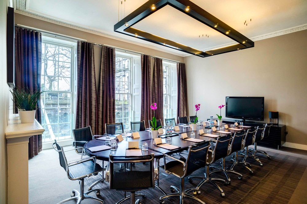 Regent room set up boardroom style for meeting with floor to ceiling windows