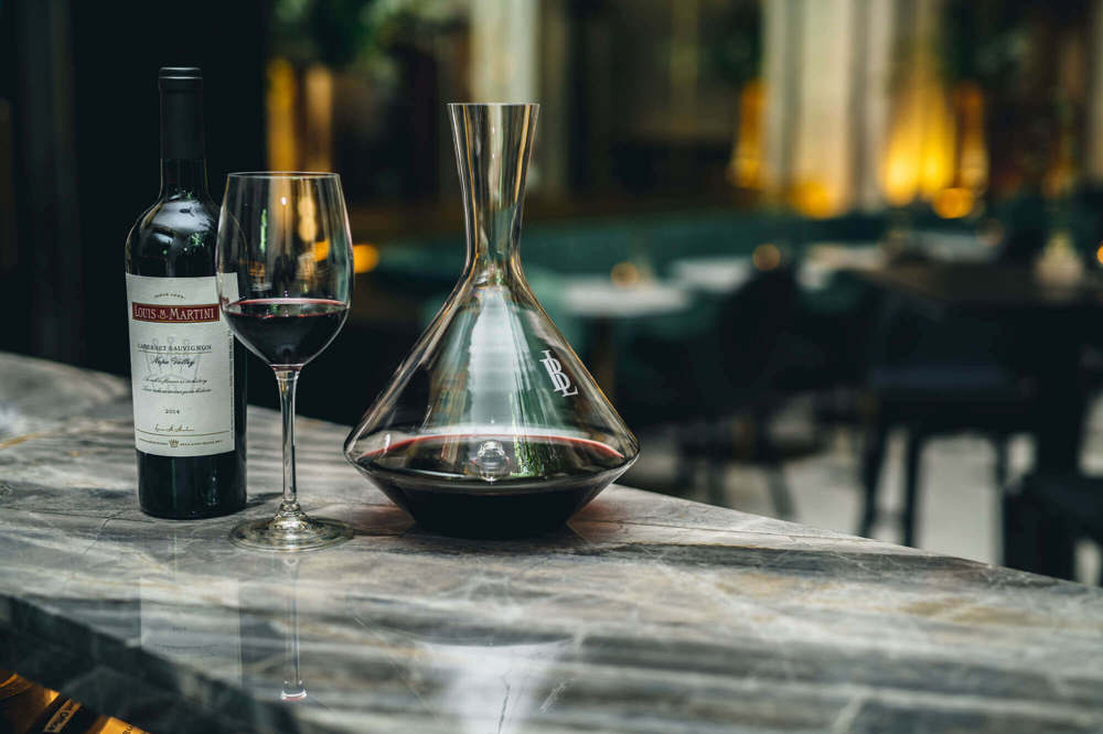 Wine at Lazy Ballerinas Bottle and glass of wine and red wine in decanter