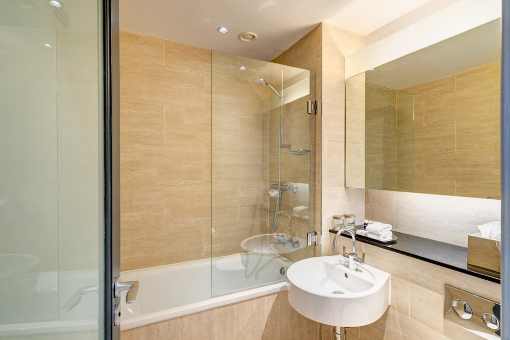 Family Room bathroom with shower over bath at Apex Grassmarket Hotel