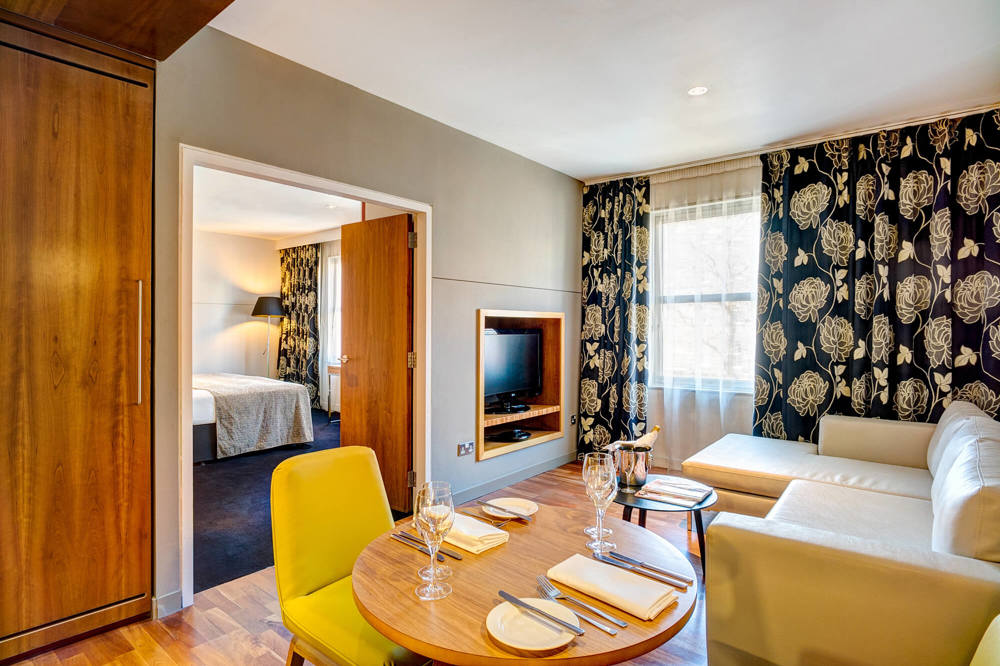 Master Suite at Apex City of Edinburgh Hotel Master Suite living area with sofa and table at Apex City of Edinburgh Hotel