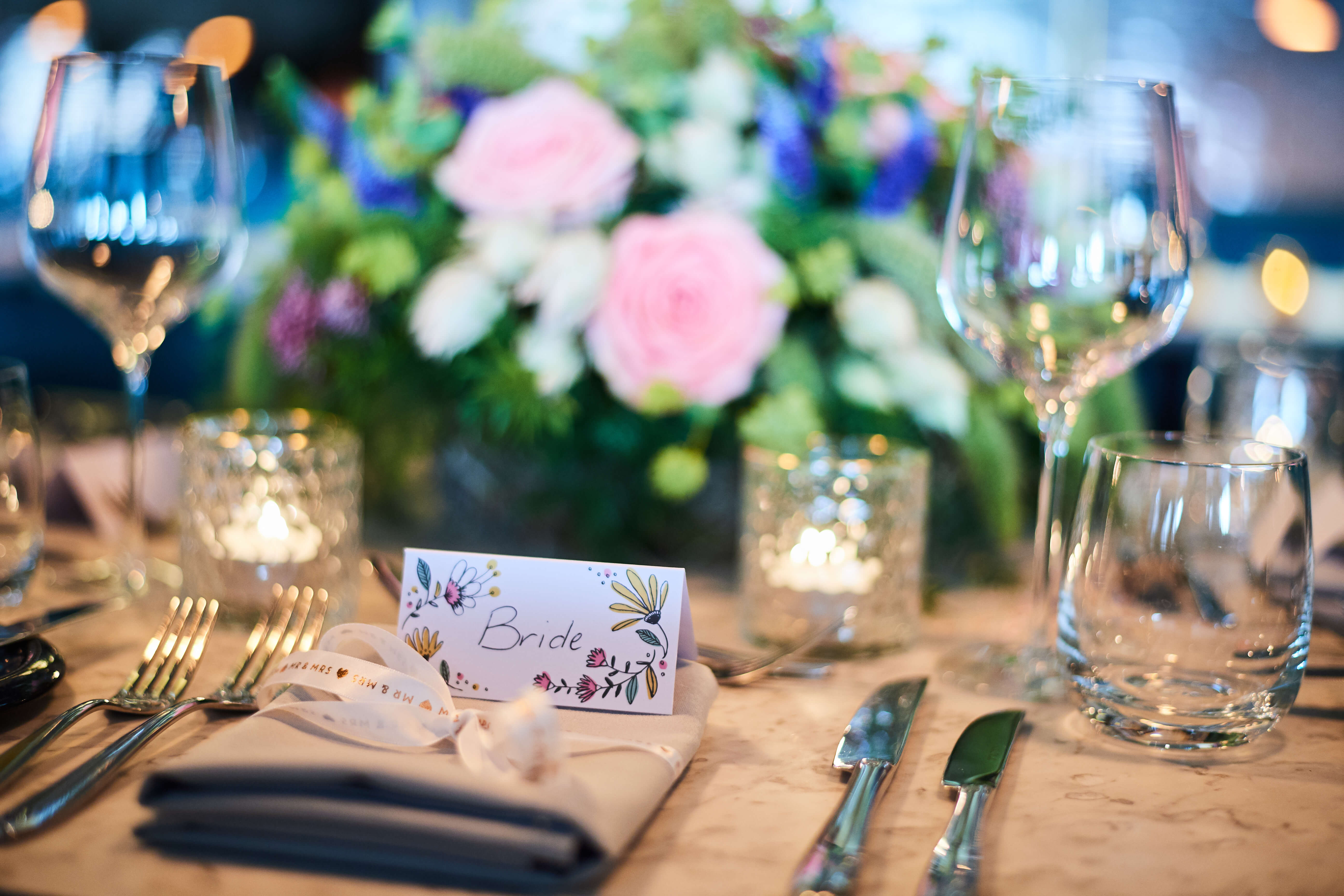 Wedding Table Setting With Place Card And Flowers