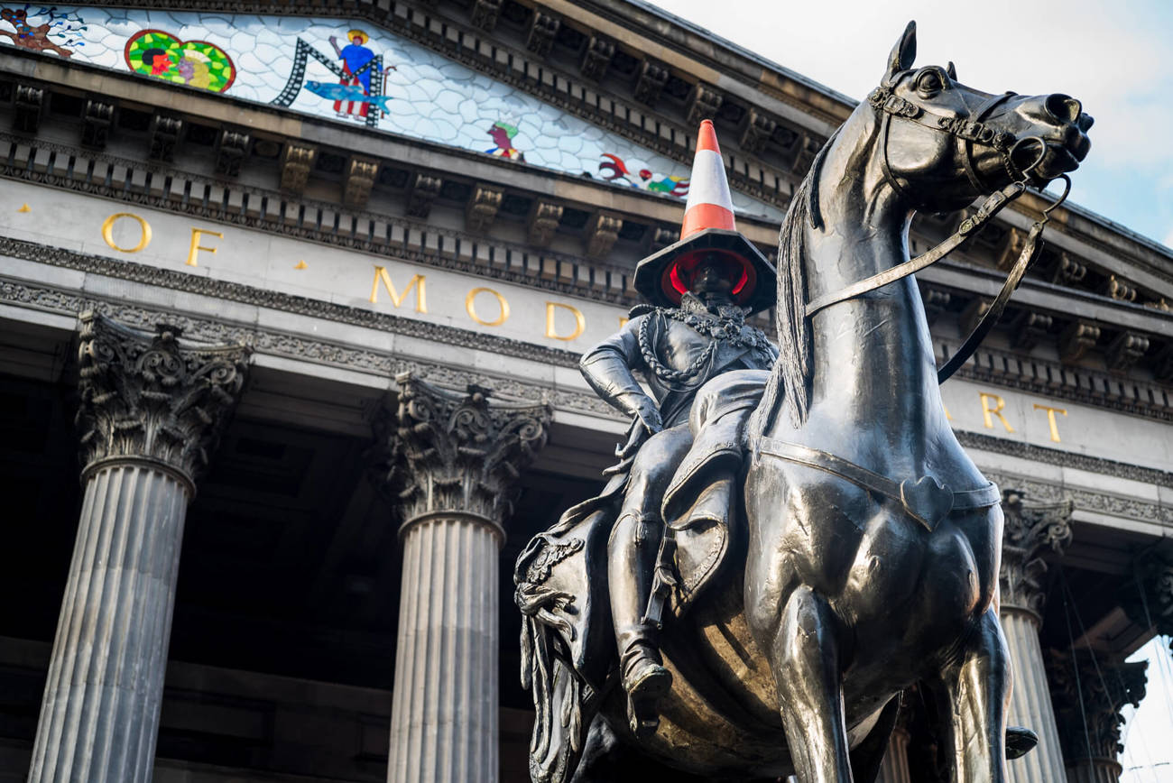 Duke of Wellington statue in Glasgow Duke of Wellington statue with traffic cone hat in front of Gallery of Modern Art in Glasgow