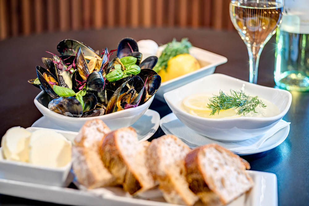 Dining at Agua Mussels with sliced bread and butter