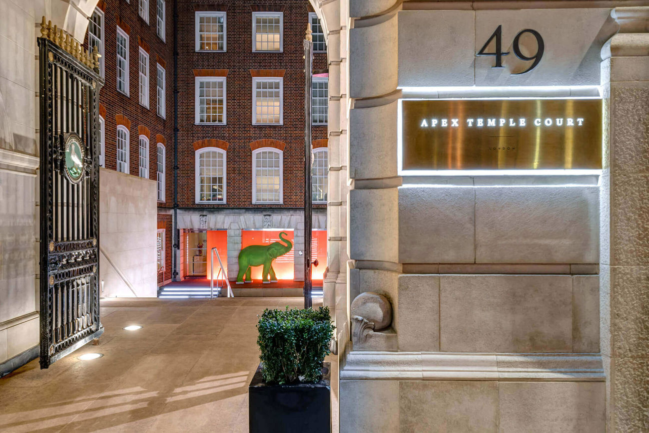 Exterior of Apex Temple Court Hotel looking into courtyard with green elephant