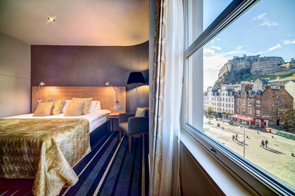 City Plus Room with queen-size bed and view of Edinburgh Castle at Apex City of Edinburgh Hotel