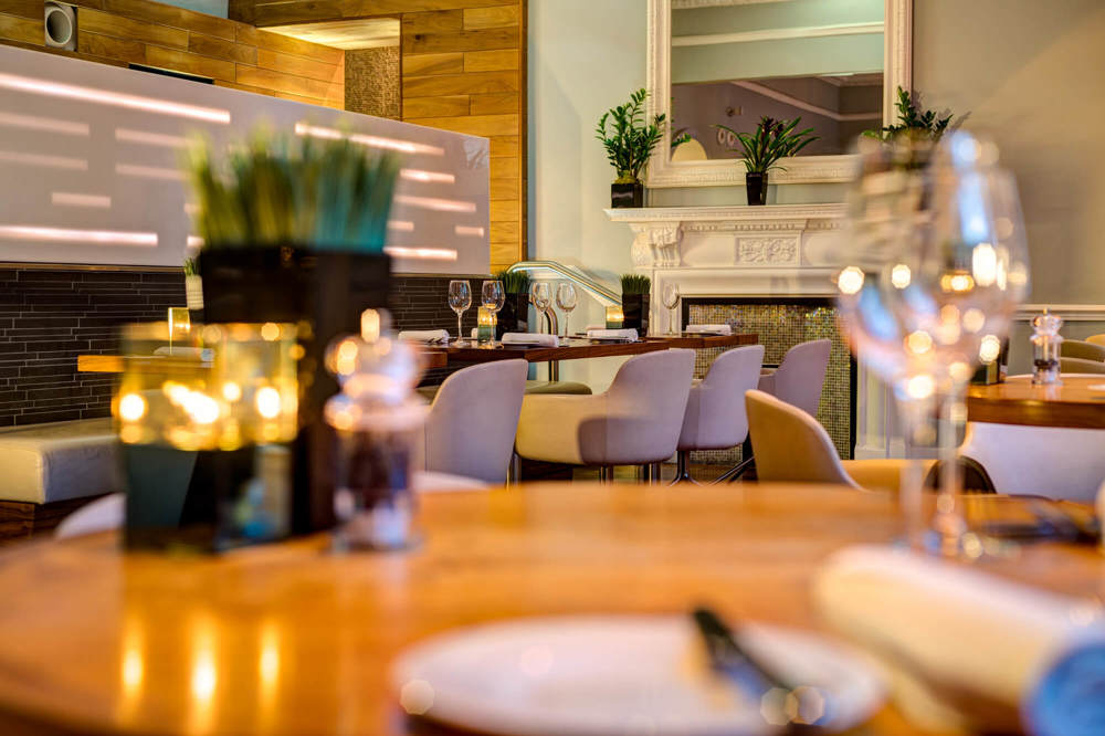 Table with candles at Elliot's at Apex Waterloo Place Hotel