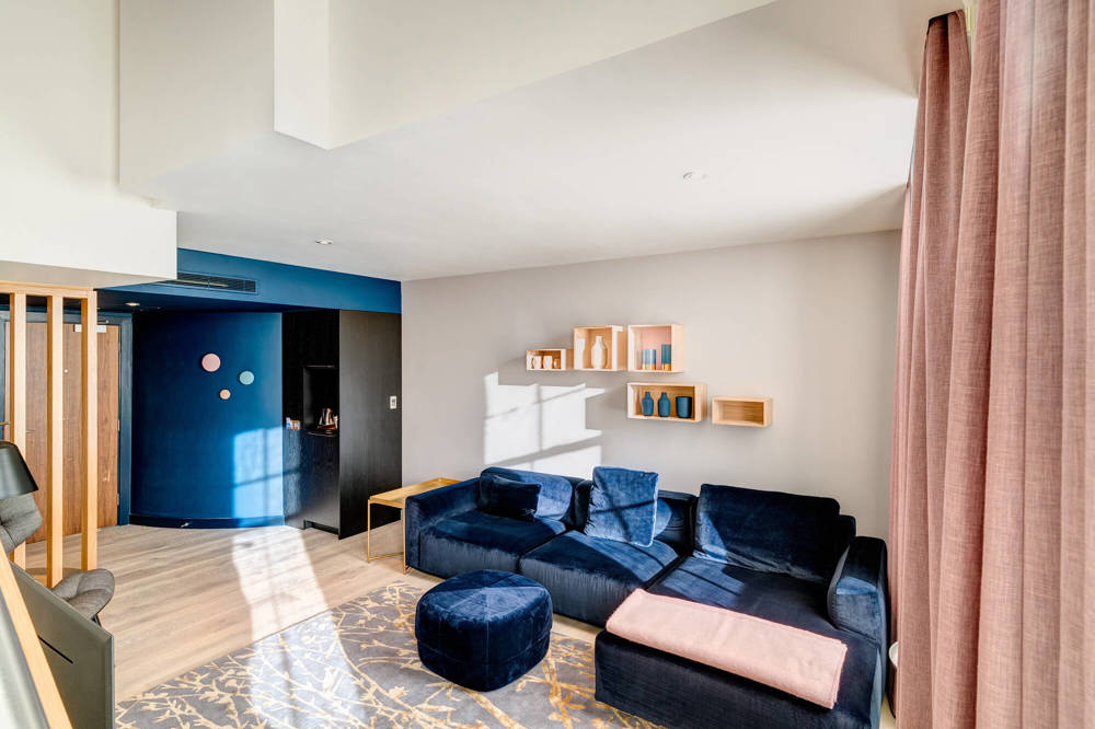 Duplex Suite at Apex Waterloo Place Hotel Duplex Suite living area with blue velvet corner sofa at Apex Waterloo Place Hotel