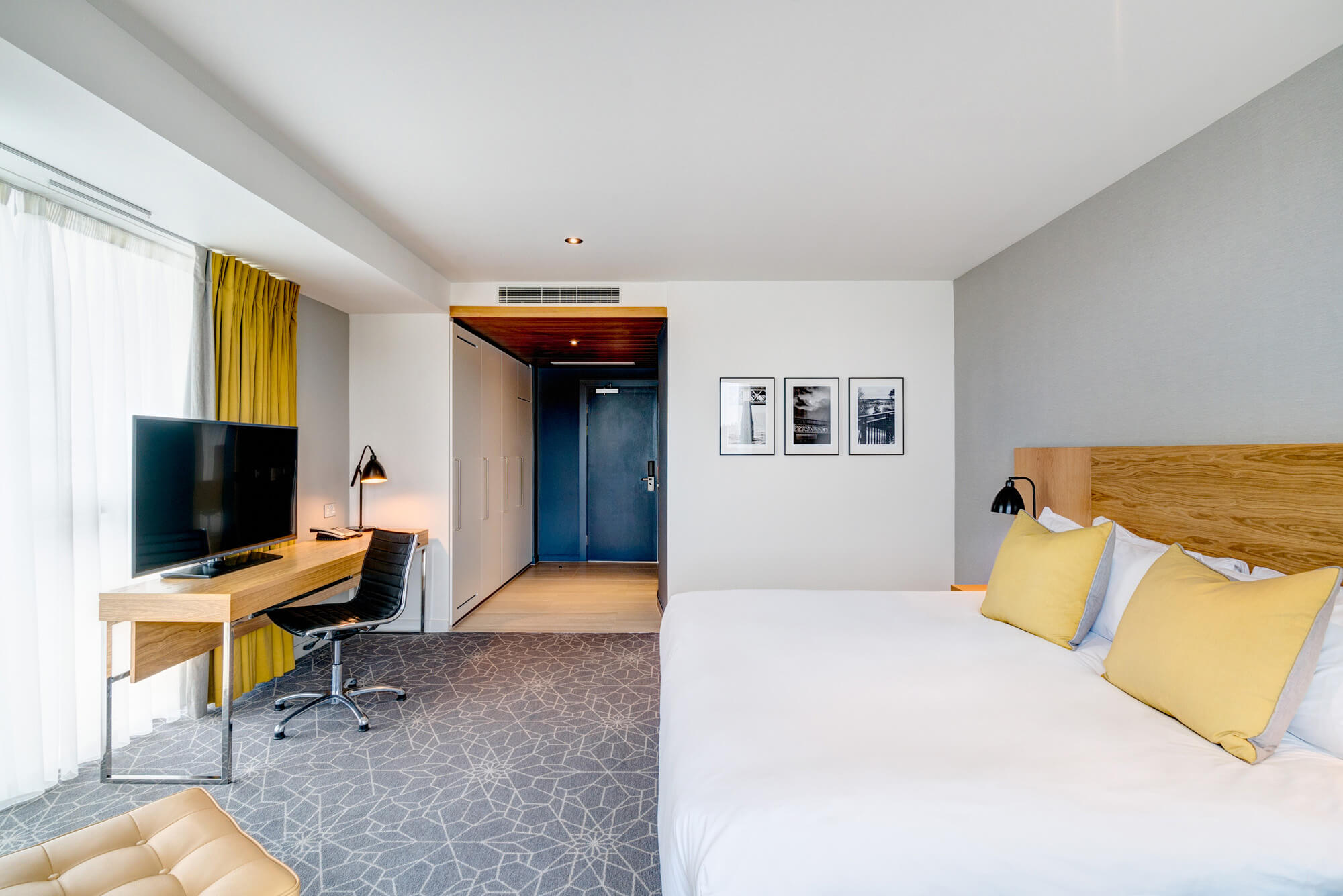 Superior Room with double bed and floor-to-ceiling windows at Apex City Quay Hotel & Spa