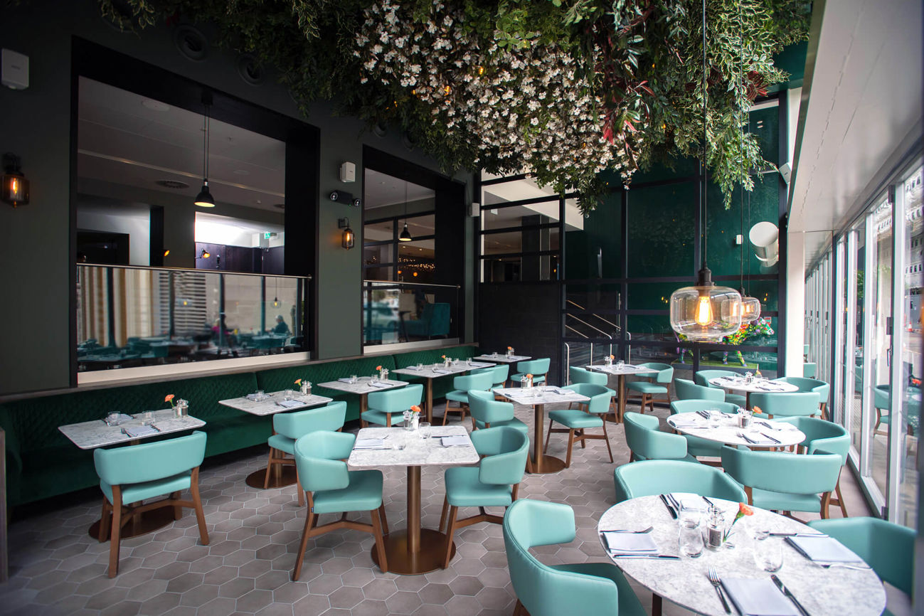 The Terrace at The Lampery at Apex City of London Hotel with tables and chairs set for dining